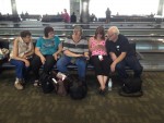 Our family group in the San Francisco airport looking at pictures  of the trip.