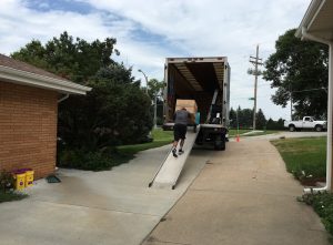 Like Sisyphus pushing the boulder, these movers worked hard to get daughter to her new place.